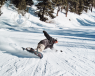 Man snowboarding down a slope