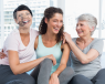 Three women of different ages sat on a safe laughing