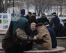 Group of old men sitting around a table in a park