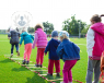 children_playing_in_the_yard_with_a_skipping_rope