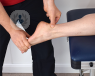 An ankle being examined by a specialist for ankle arthritis.