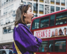 Woman tired and yawning in a street in London