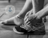 Black & white photo of sports person's ankle
