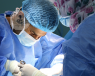 A picture of two surgeons performing liver surgery 
