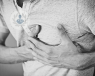 an image of a man clutching at his chest