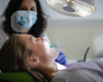 a picture of a girl at the dentist