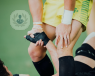 Football match, footballer holding his knee