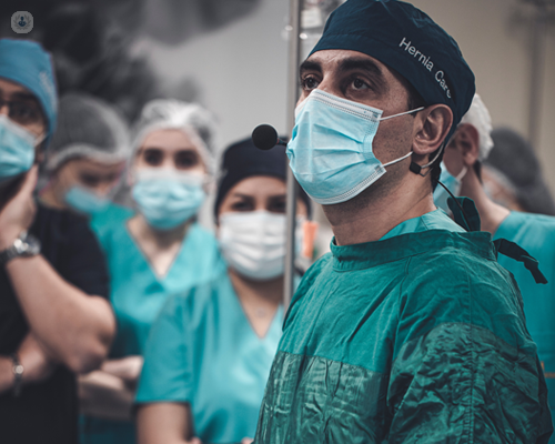 Surgeon undertaking inguinal hernia surgery