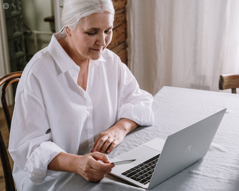 Older woman checking her laptop