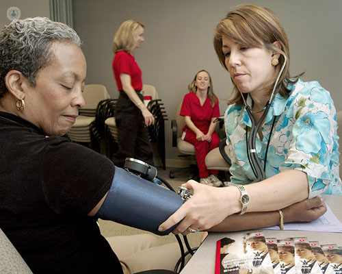 Lady with hypertension having her blood pressure monitored