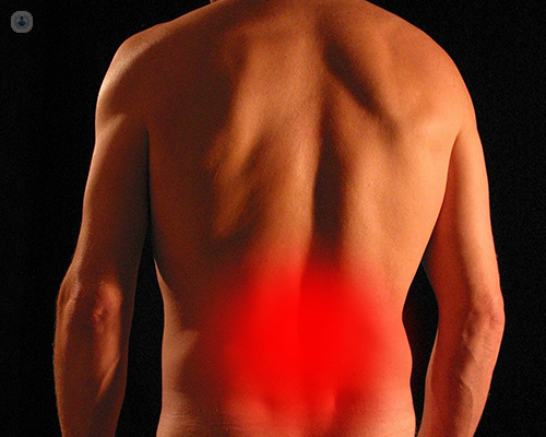 A red haze over a man's lower back to signify lower back pain.