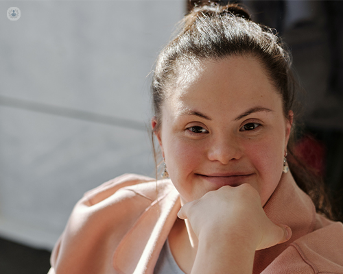 Young woman with Down's Syndrome smiling