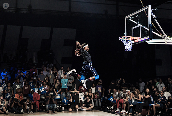 Basketball player going for a slum dunk