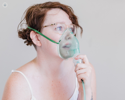 Girl using a nebuliser for her asthma