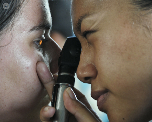 Young girl having an eye exam to diagnose diabetic retinopathy