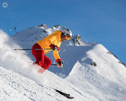 A skier moving down a slope