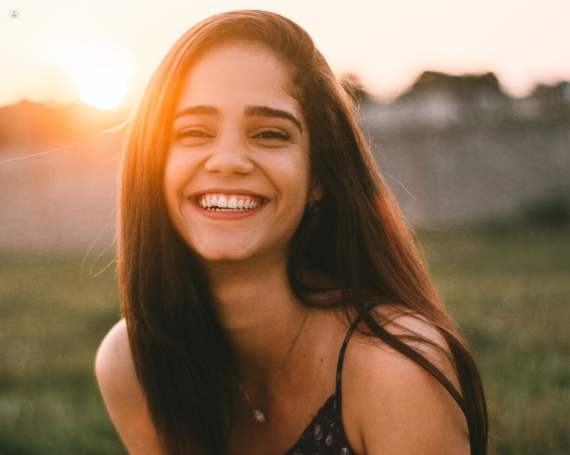 girl smiling in field