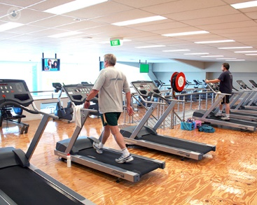 A man walking and doing cardio on a treadmill