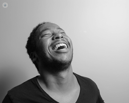 Man laughing - it's a trigger for cataplexy, a symptom of narcolepsy