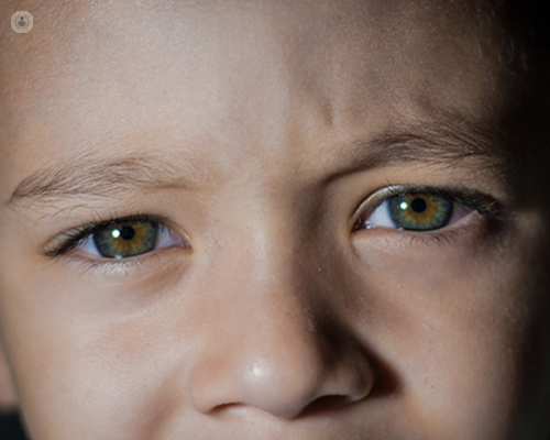Close up of a young boy's hazel eyes